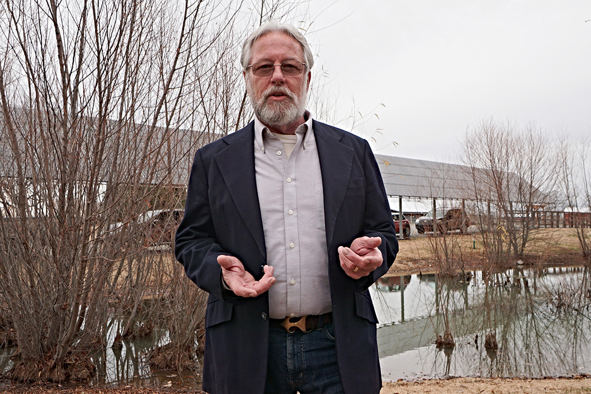 William Ball, owner of Stellar Sun of Little Rock, at an array he designed at Heifer International's headquarters in Little Rock.