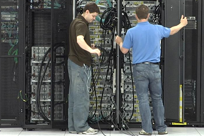 Technicians work at the Windstream Corp. data center in Little Rock. (Photo by Trent Ogle)